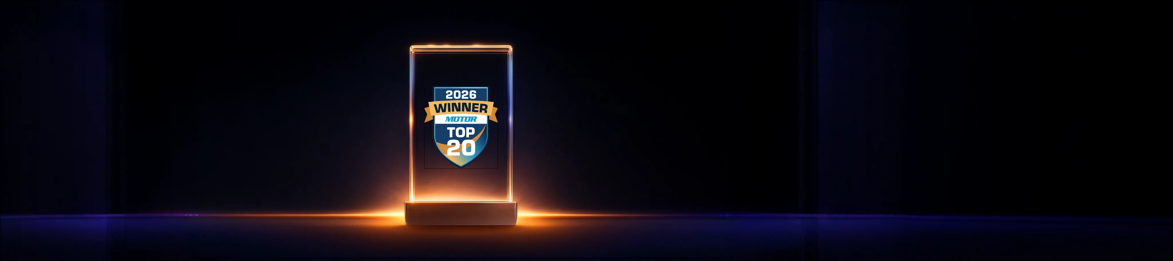 The 2026 MOTOR Top 20 Awards winner trophy: a lit glass block holding the MOTOR Top 20 winner's badge